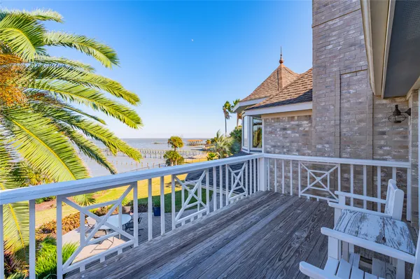 a view of balcony with wooden floor
