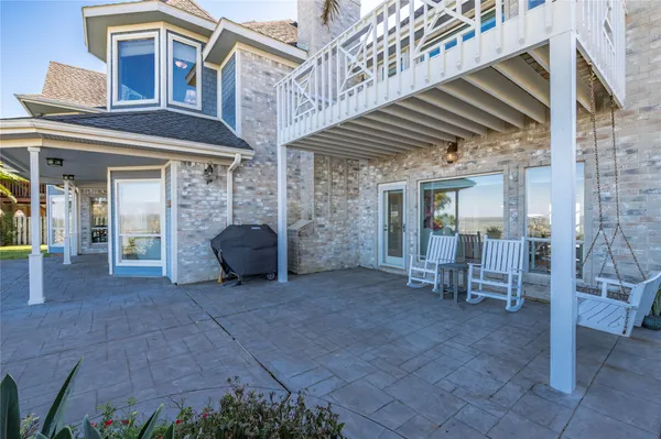 a view of living room with furniture and a large window