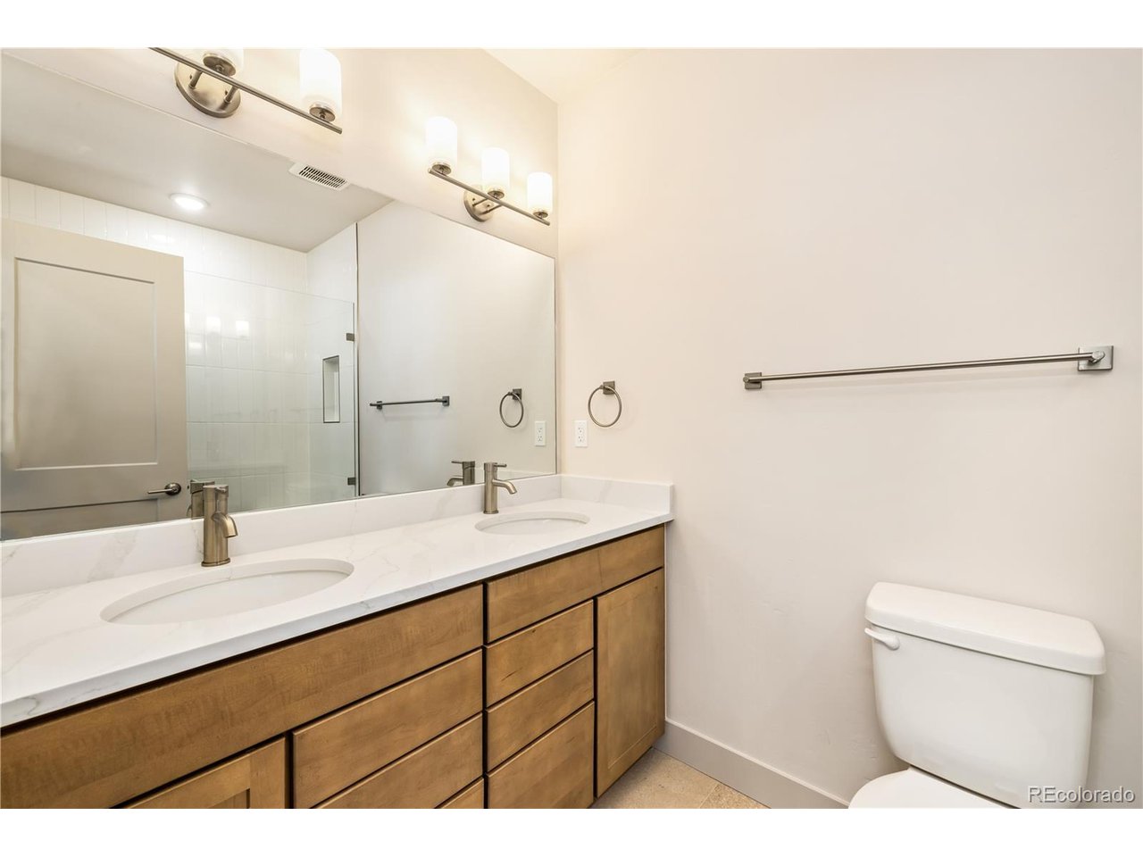624 Montezuma Road, Unit D Keystone, CO 80435 - Photo 11 of 31 a bathroom with a sink toilet a mirror and vanity