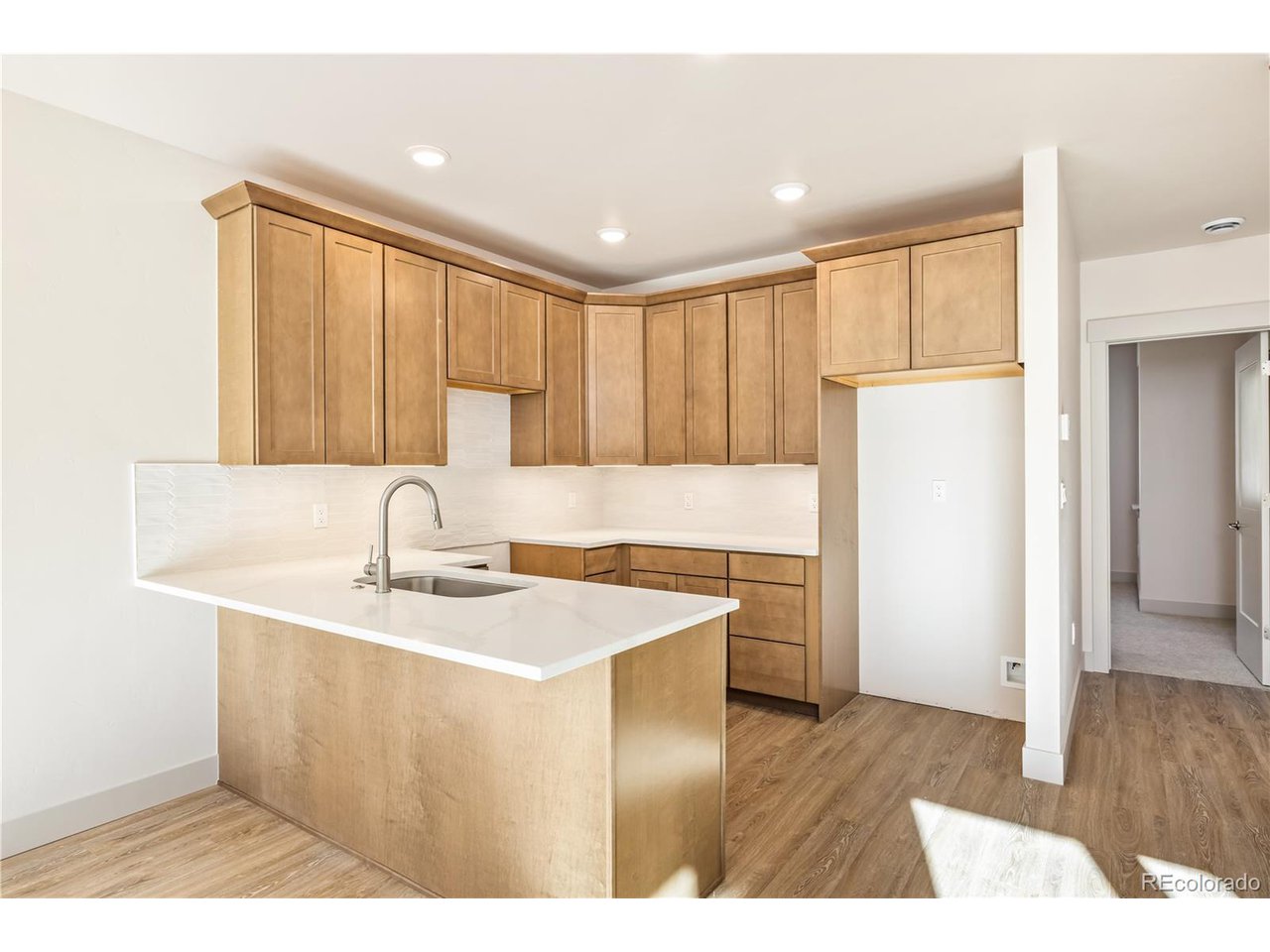 624 Montezuma Road, Unit D Keystone, CO 80435 - Photo 6 of 31 a kitchen with a sink a stove a refrigerator a center island and cabinets