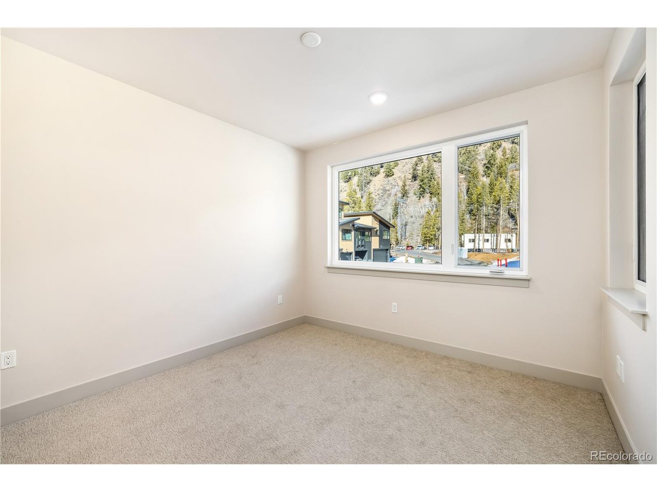 624 Montezuma Road, Unit D Keystone, CO 80435 - Photo 9 of 31 an empty room with windows