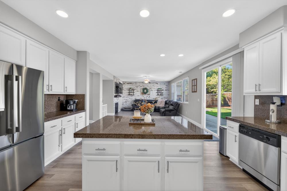 1820 Donner Road West Sacramento, CA 95691 - Photo 16 of 44 a kitchen with granite countertop a sink appliances cabinets and counter space