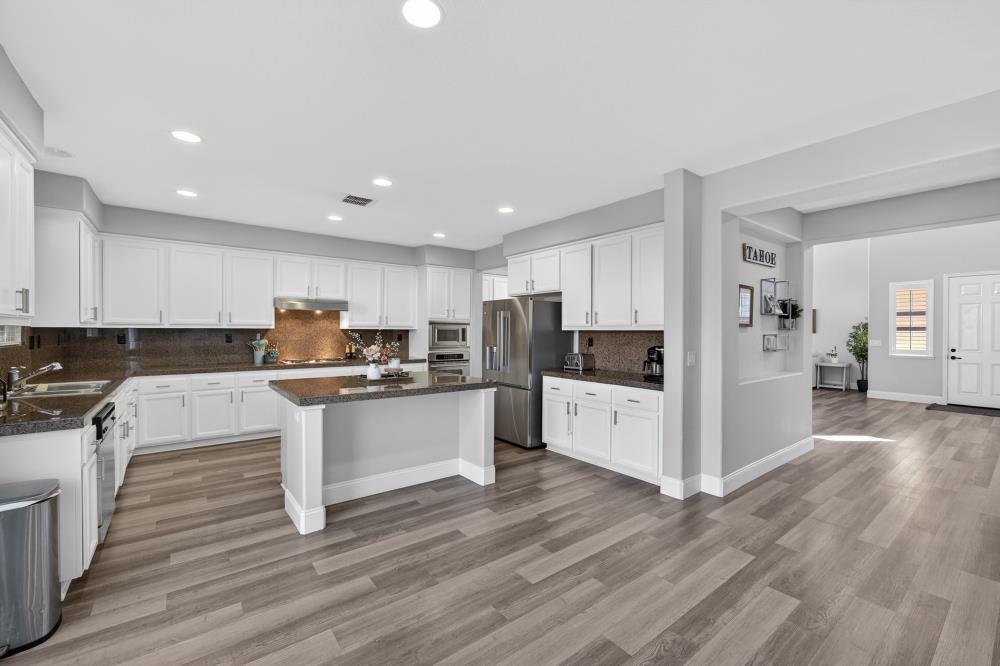 1820 Donner Road West Sacramento, CA 95691 - Photo 39 of 44 a kitchen with white cabinets and white appliances