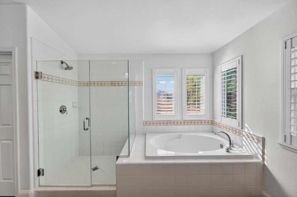 1820 Donner Road West Sacramento, CA 95691 - Photo 40 of 44 a bathroom with a bathtub and a shower