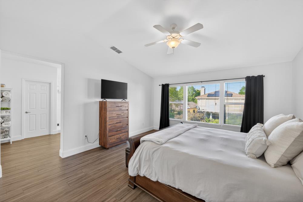 1820 Donner Road West Sacramento, CA 95691 - Photo 5 of 44 a bedroom with a large bed and a tv