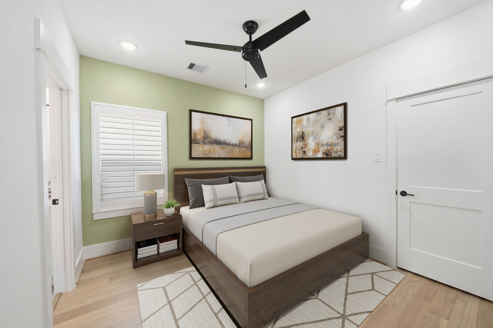 9018 Wellspring Drive Houston, TX 77080 - Photo 14 of 25 Virtually Staged: This inviting secondary bedroom showcases a serene sage green accent wall, sleek engineered wood floors, and premium plantation shutters for the perfect blend of style and comfort.