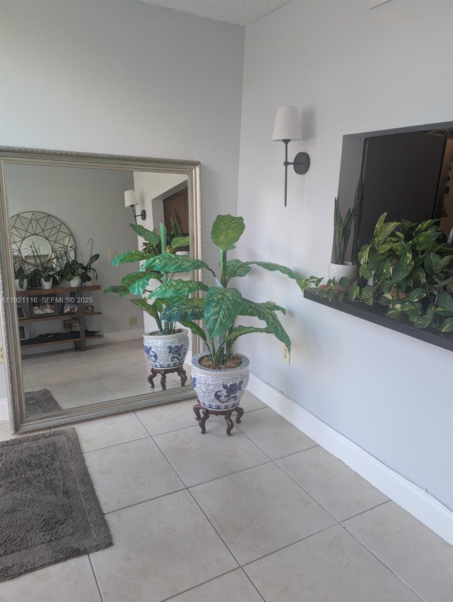 9401 Southwest 4th Street, Unit 110 Miami, FL 33174 - Photo 5 of 8 a view of a livingroom with furniture