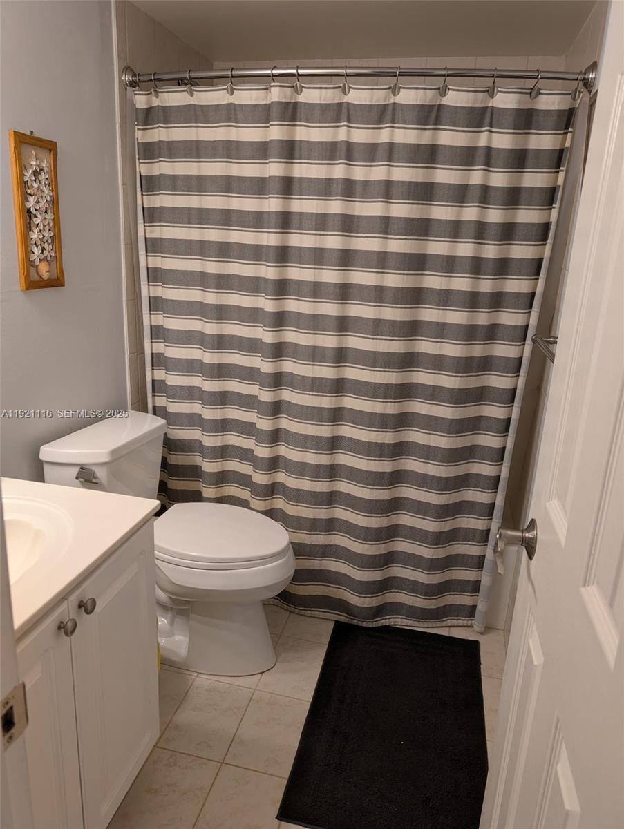 9401 Southwest 4th Street, Unit 110 Miami, FL 33174 - Photo 6 of 8 a bathroom with a sink and a toilet