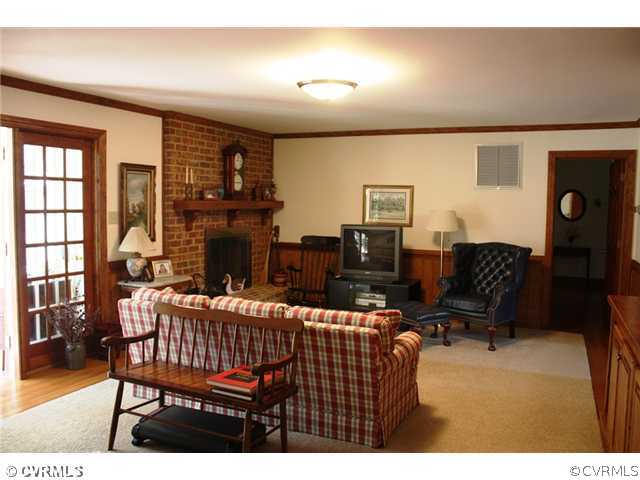 11630 Buckhorn Road Chesterfield, VA 23838 - Photo 5 of 20 a living room with furniture and a fireplace
