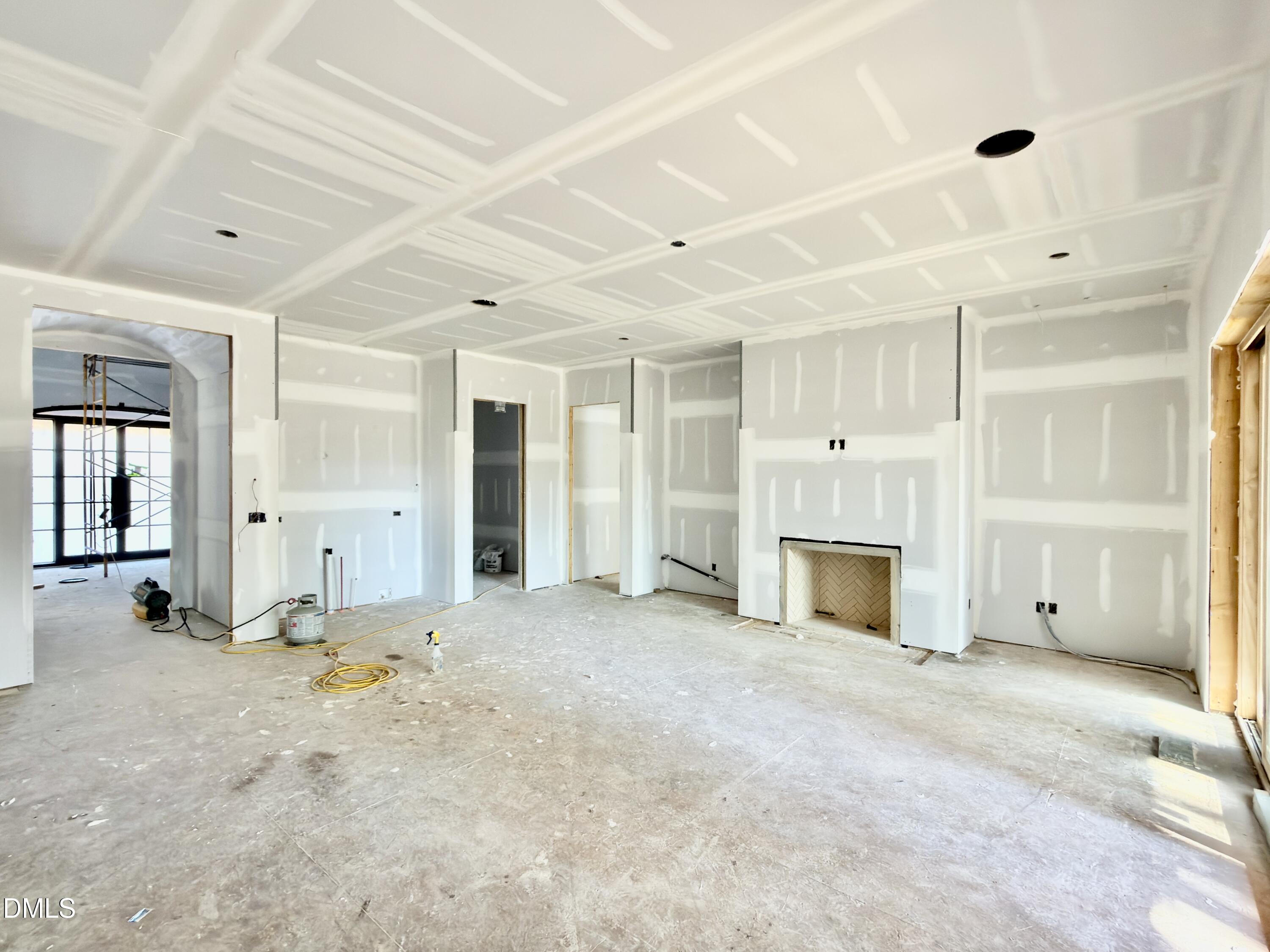 6832 Greystone Drive Raleigh, NC 27615 - Photo 15 of 51 a view of an empty room with a fireplace