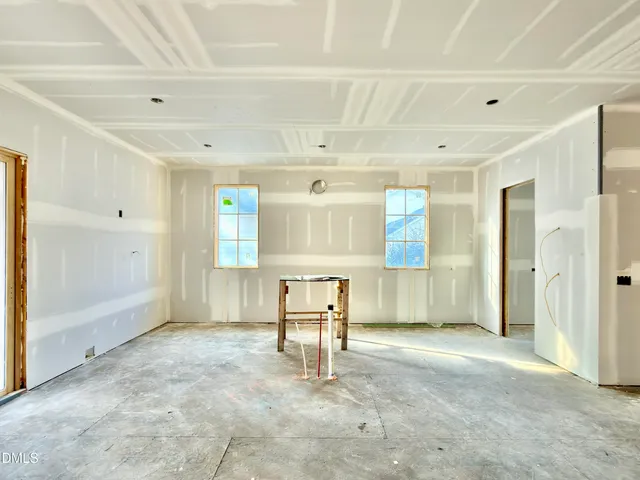 a view of a big room with closet and windows