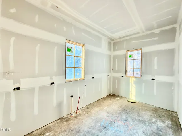 a bathroom with a tub and a window