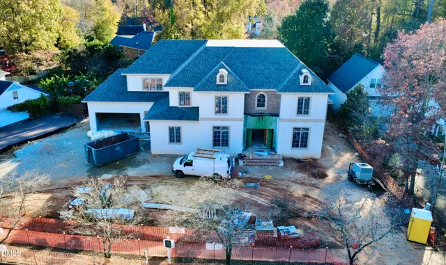 a view of a house with a yard and garage