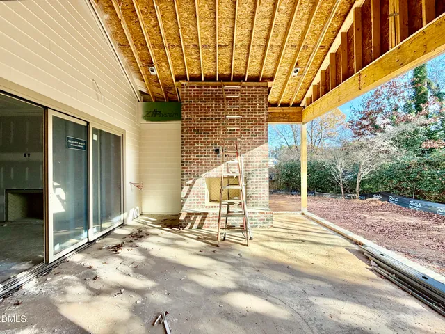 a bathroom with a tub a window and a shower
