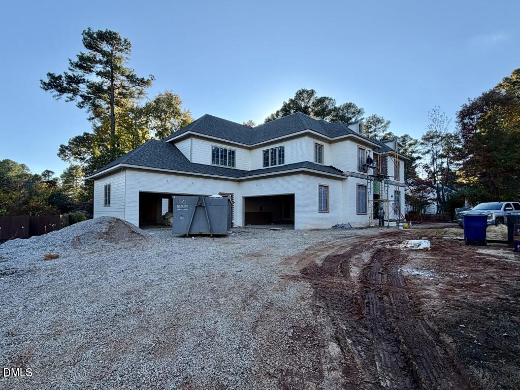 6832 Greystone Drive Raleigh, NC 27615 - Photo 4 of 51 a view of a house with a yard and garage