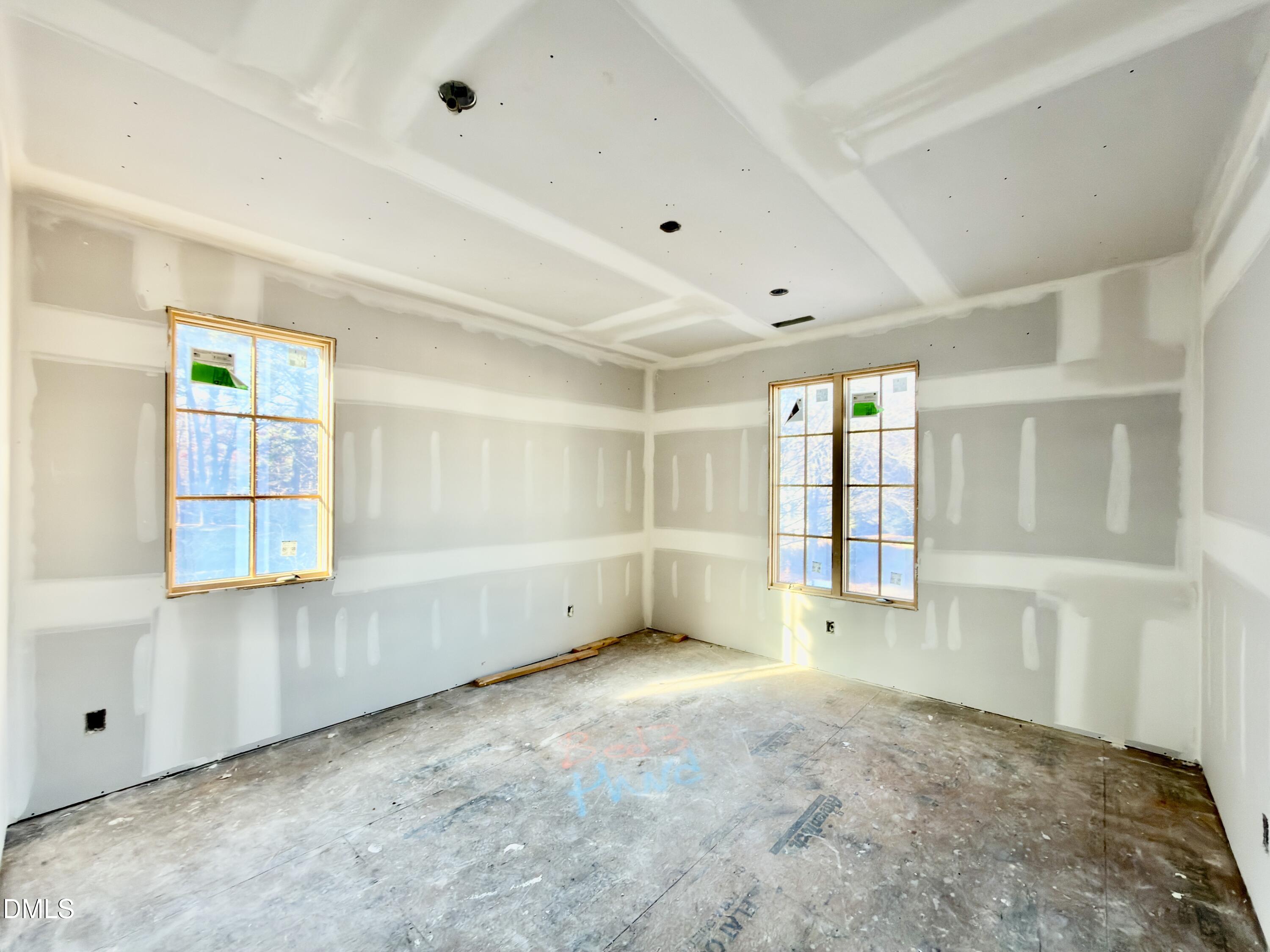 6832 Greystone Drive Raleigh, NC 27615 - Photo 42 of 51 an empty room with windows