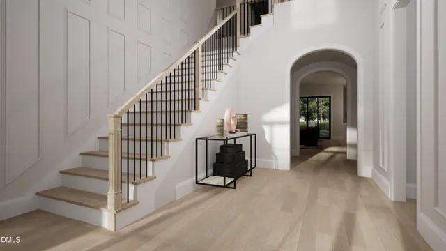 a view of staircase with wooden floor and a large window