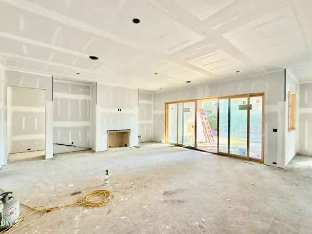 a living room with furniture fireplace and flat screen tv