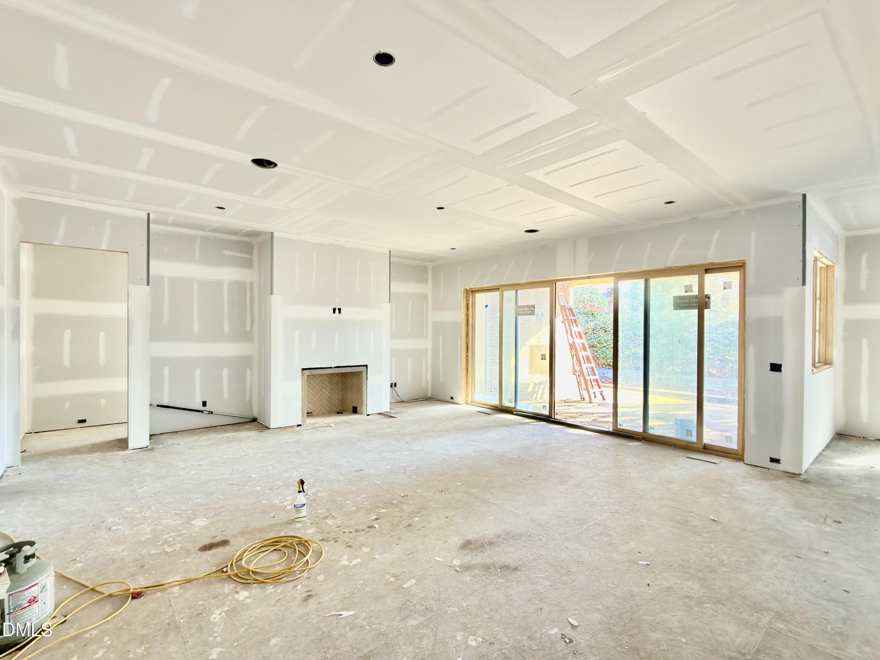 6832 Greystone Drive Raleigh, NC 27615 - Photo 10 of 51 a view of an empty room with a fireplace