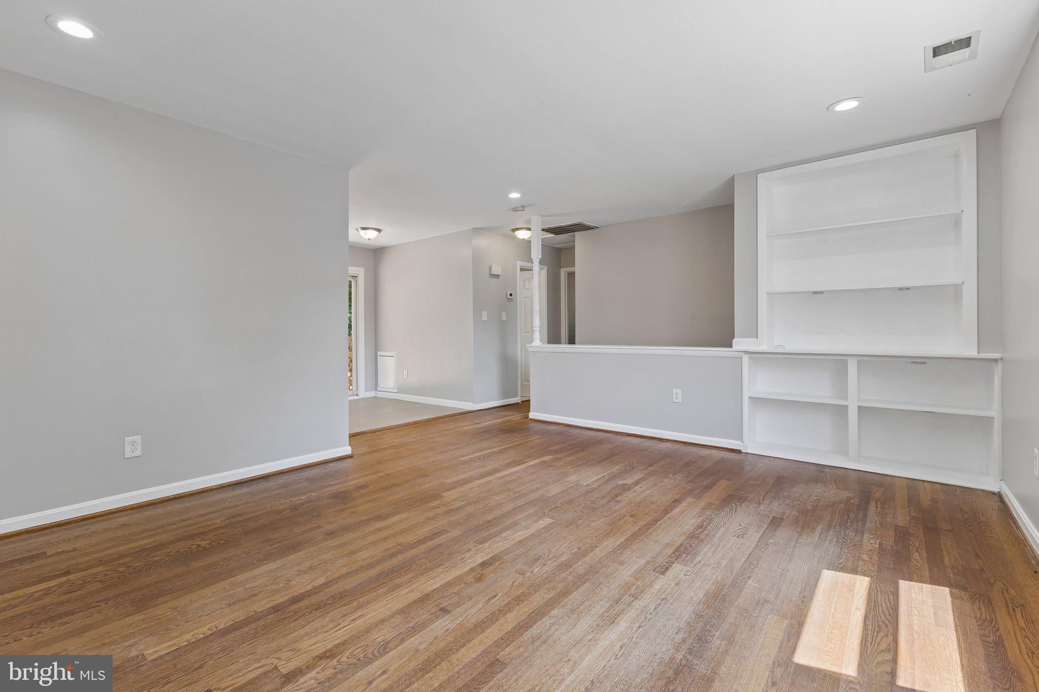 14197 Fullerton Road Woodbridge, VA 22193 - Photo 13 of 23 a view of an empty room with a window and wooden floor