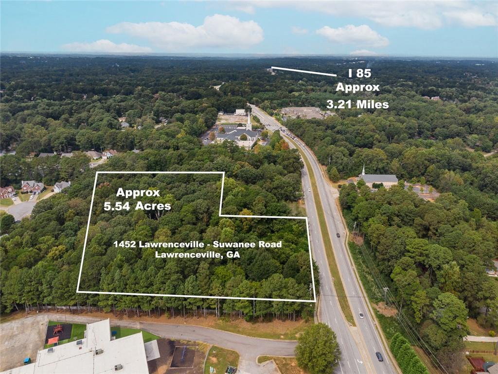 1452 Lawrenceville-Suwanee Road Lawrenceville, GA 30043 - Photo 2 of 4 an aerial view of a city