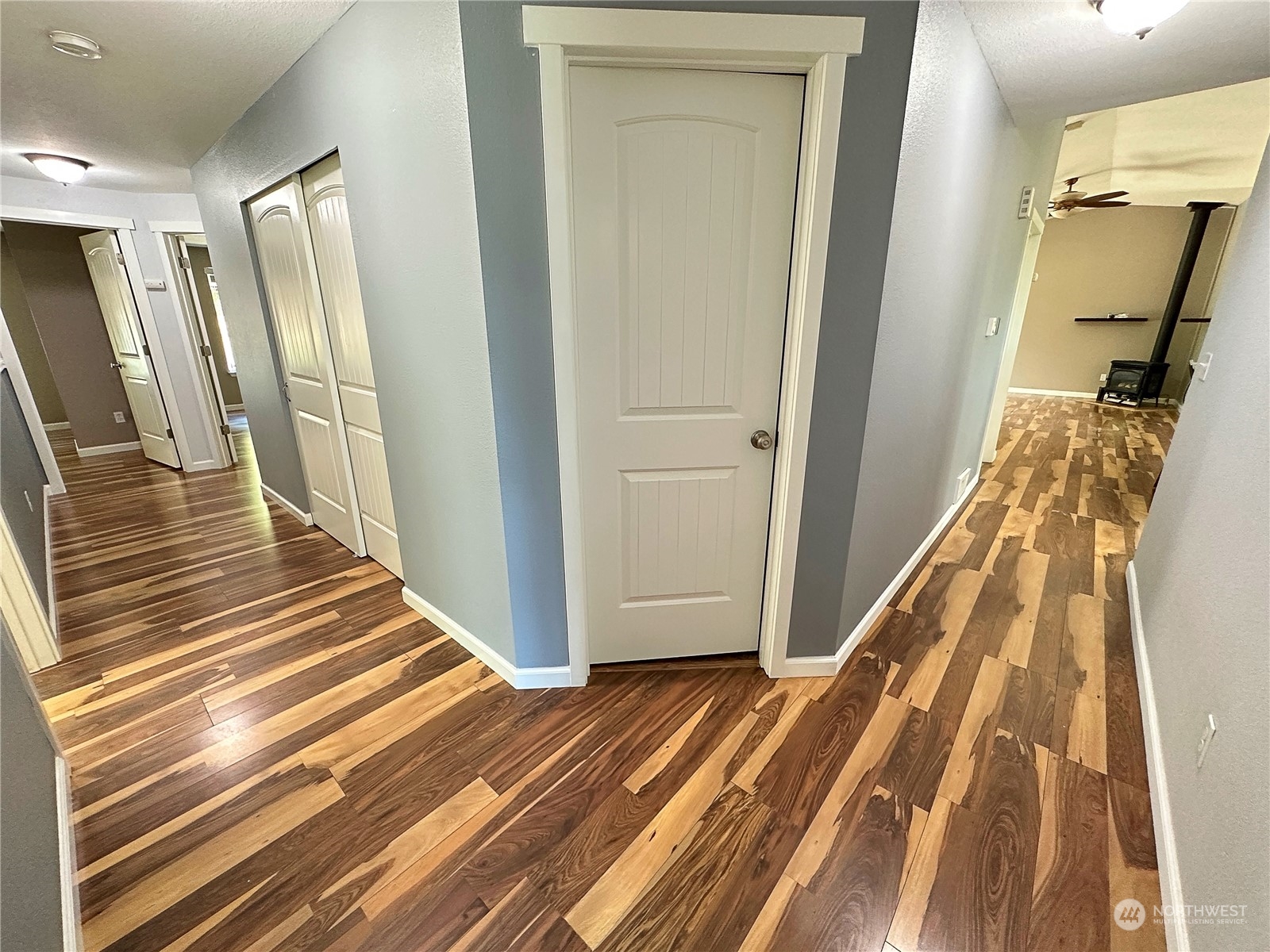 8307 Waddell Creek Road Southwest Olympia, WA 98512 - Photo 11 of 33 a view of a hallway with wooden floor and entryway