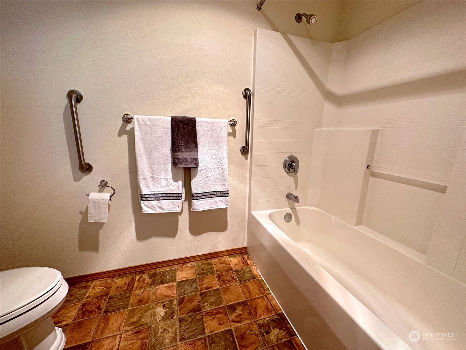8307 Waddell Creek Road Southwest Olympia, WA 98512 - Photo 16 of 33 a bathroom with a sink a toilet and shower