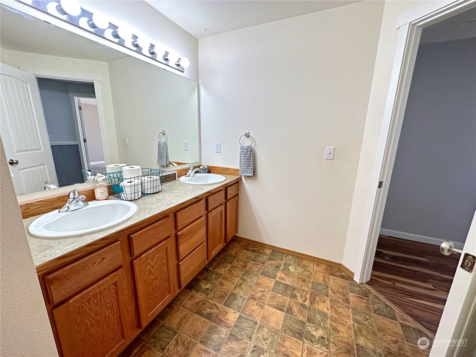8307 Waddell Creek Road Southwest Olympia, WA 98512 - Photo 17 of 33 a bathroom with a sink and a mirror
