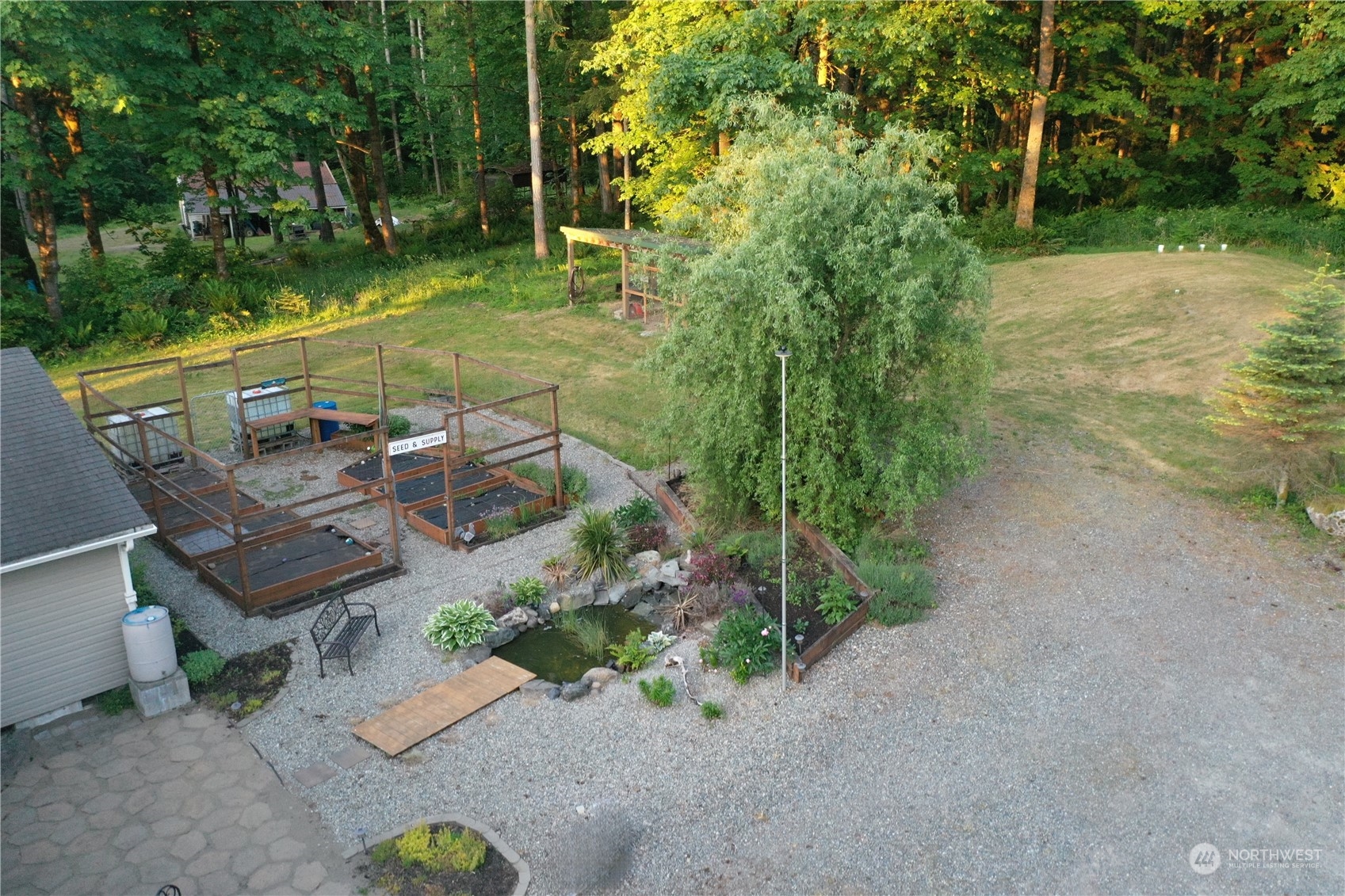 8307 Waddell Creek Road Southwest Olympia, WA 98512 - Photo 22 of 33 a view of a backyard with sitting area