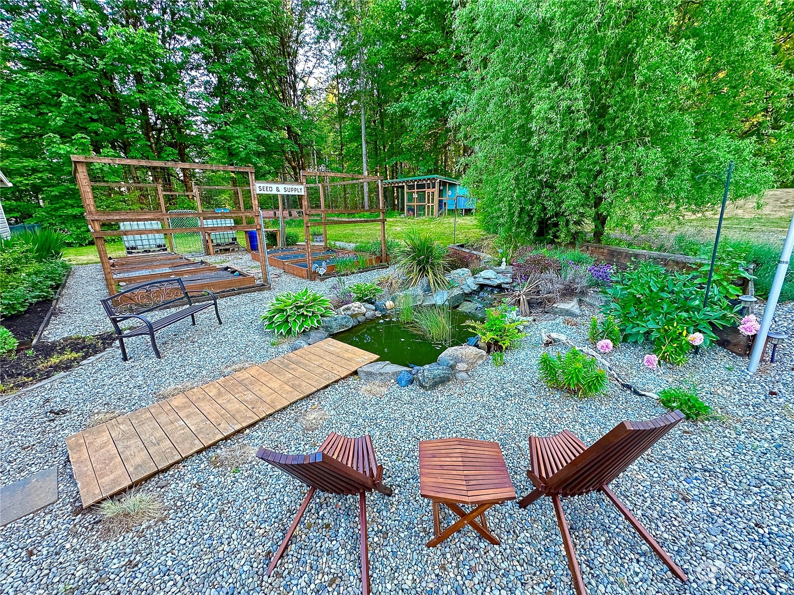 8307 Waddell Creek Road Southwest Olympia, WA 98512 - Photo 24 of 33 a backyard of a house with table and chairs