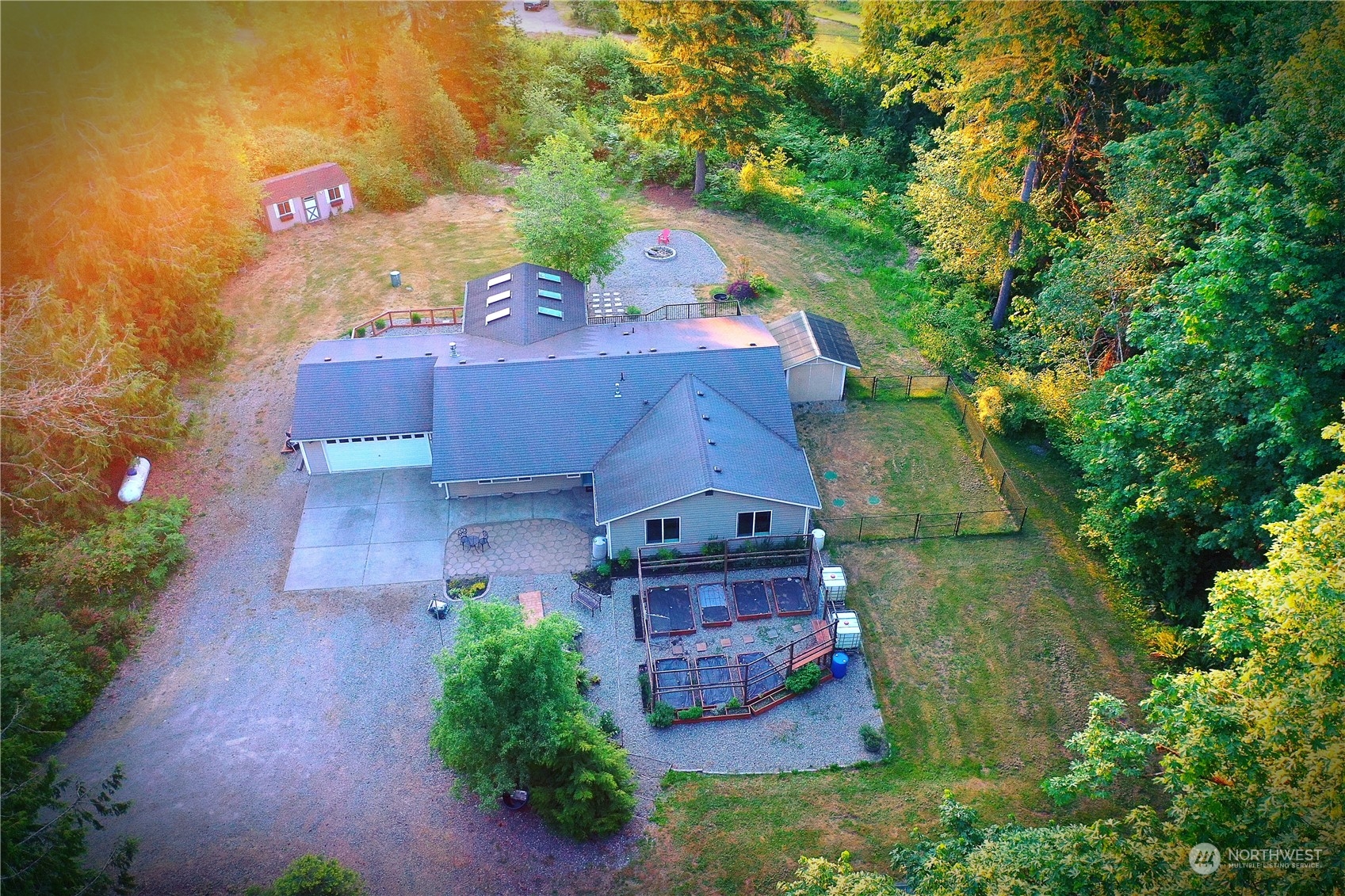 8307 Waddell Creek Road Southwest Olympia, WA 98512 - Photo 3 of 33 an aerial view of a house with a garden