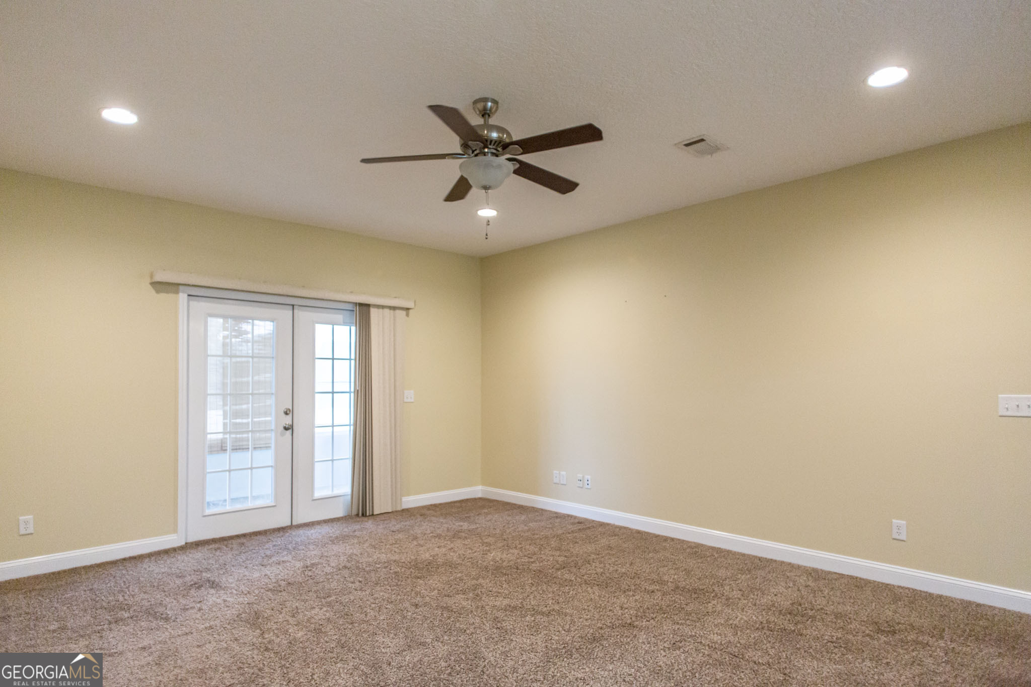 2869 Ben Street Waycross, GA 31503 - Photo 12 of 37 an empty room with closet and windows