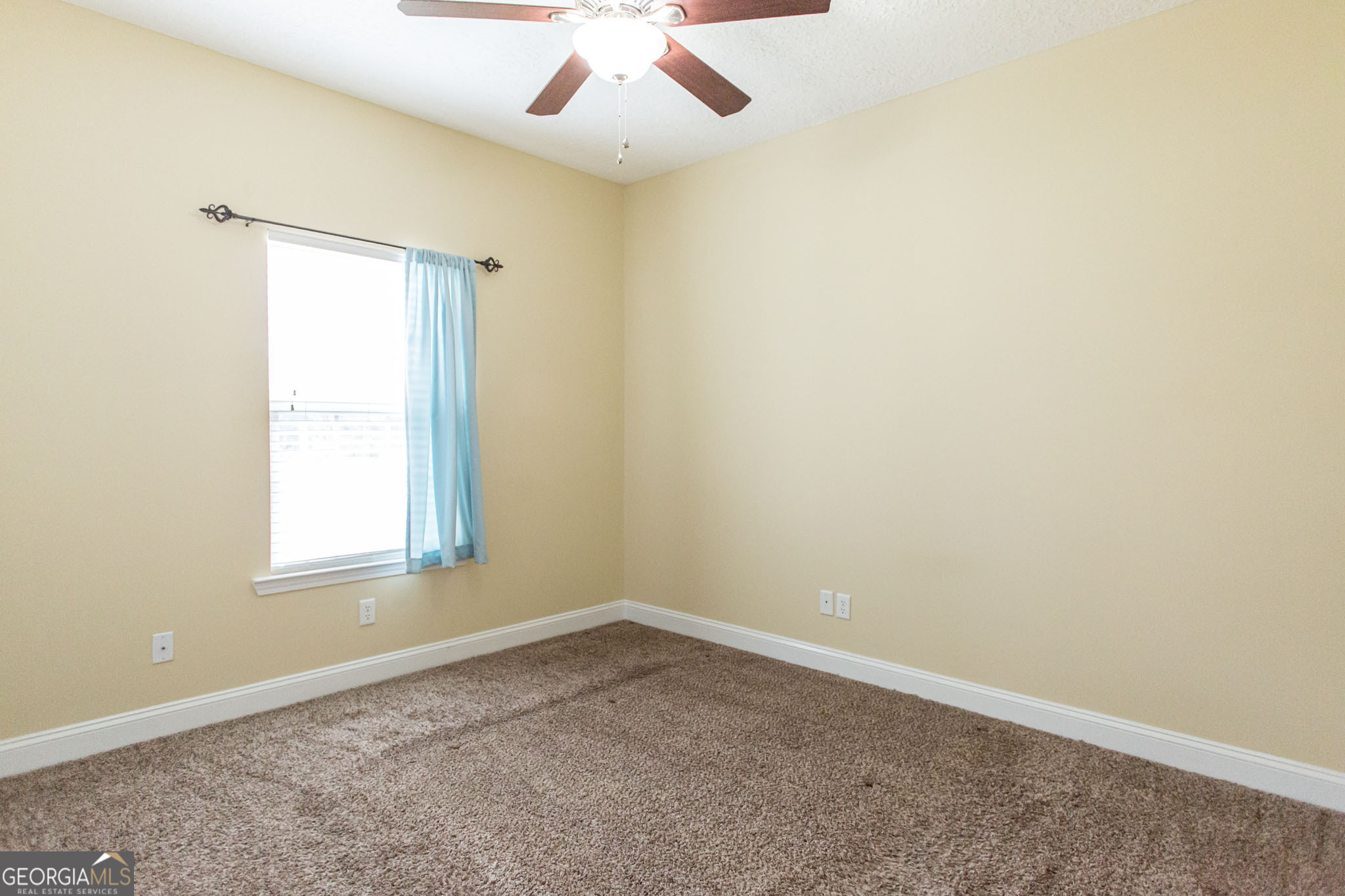 2869 Ben Street Waycross, GA 31503 - Photo 17 of 37 an empty room with a window