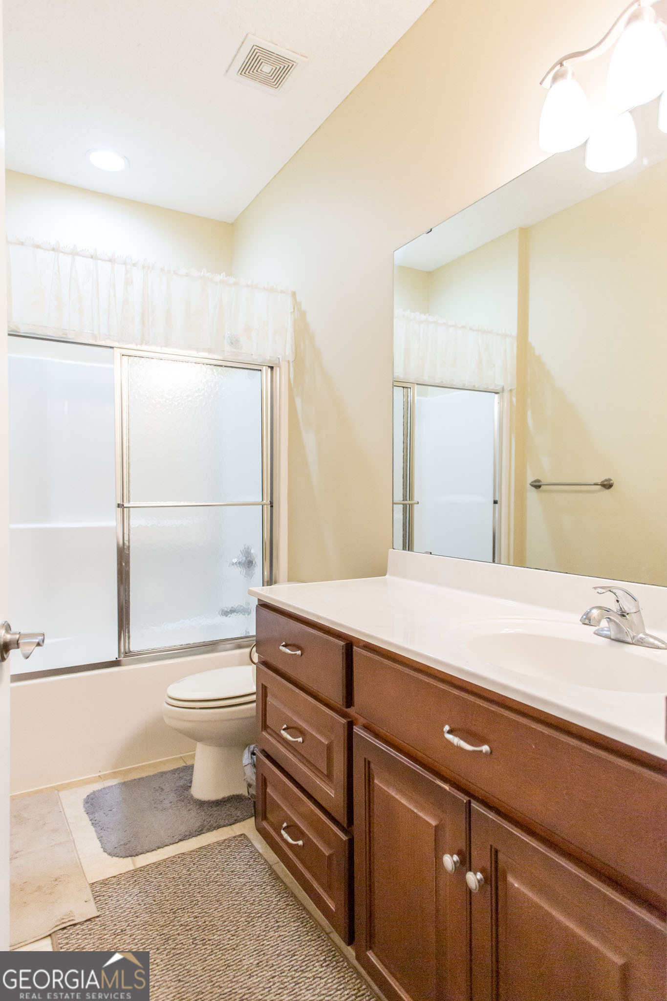 2869 Ben Street Waycross, GA 31503 - Photo 19 of 37 a bathroom with a sink a toilet and shower