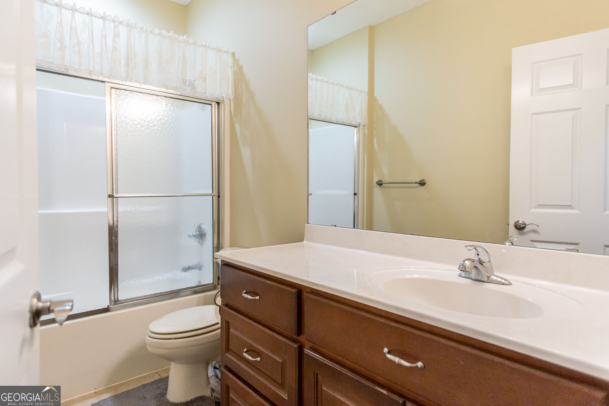 2869 Ben Street Waycross, GA 31503 - Photo 21 of 37 a bathroom with a sink toilet and shower
