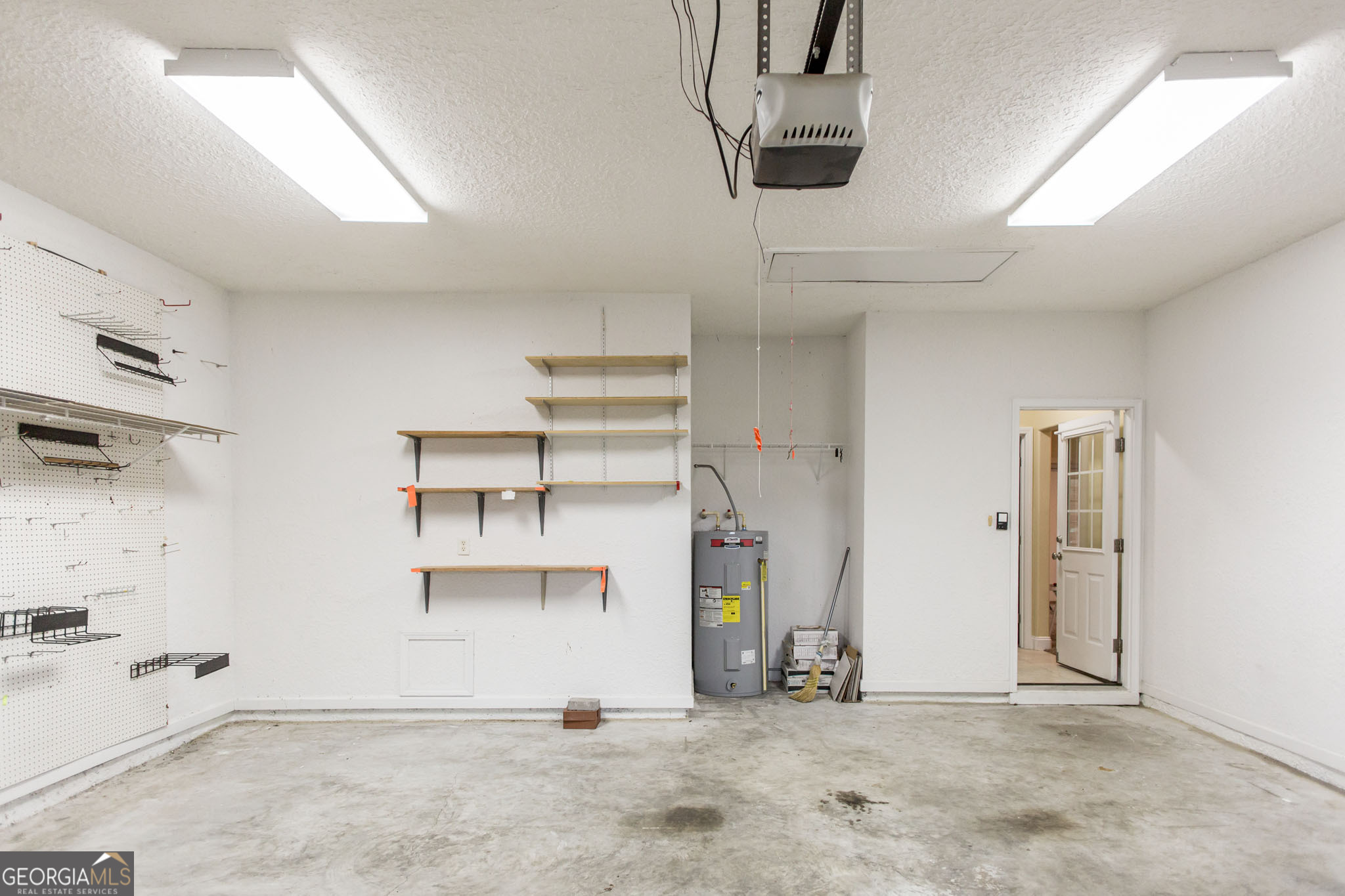 2869 Ben Street Waycross, GA 31503 - Photo 31 of 37 an empty room with shelves