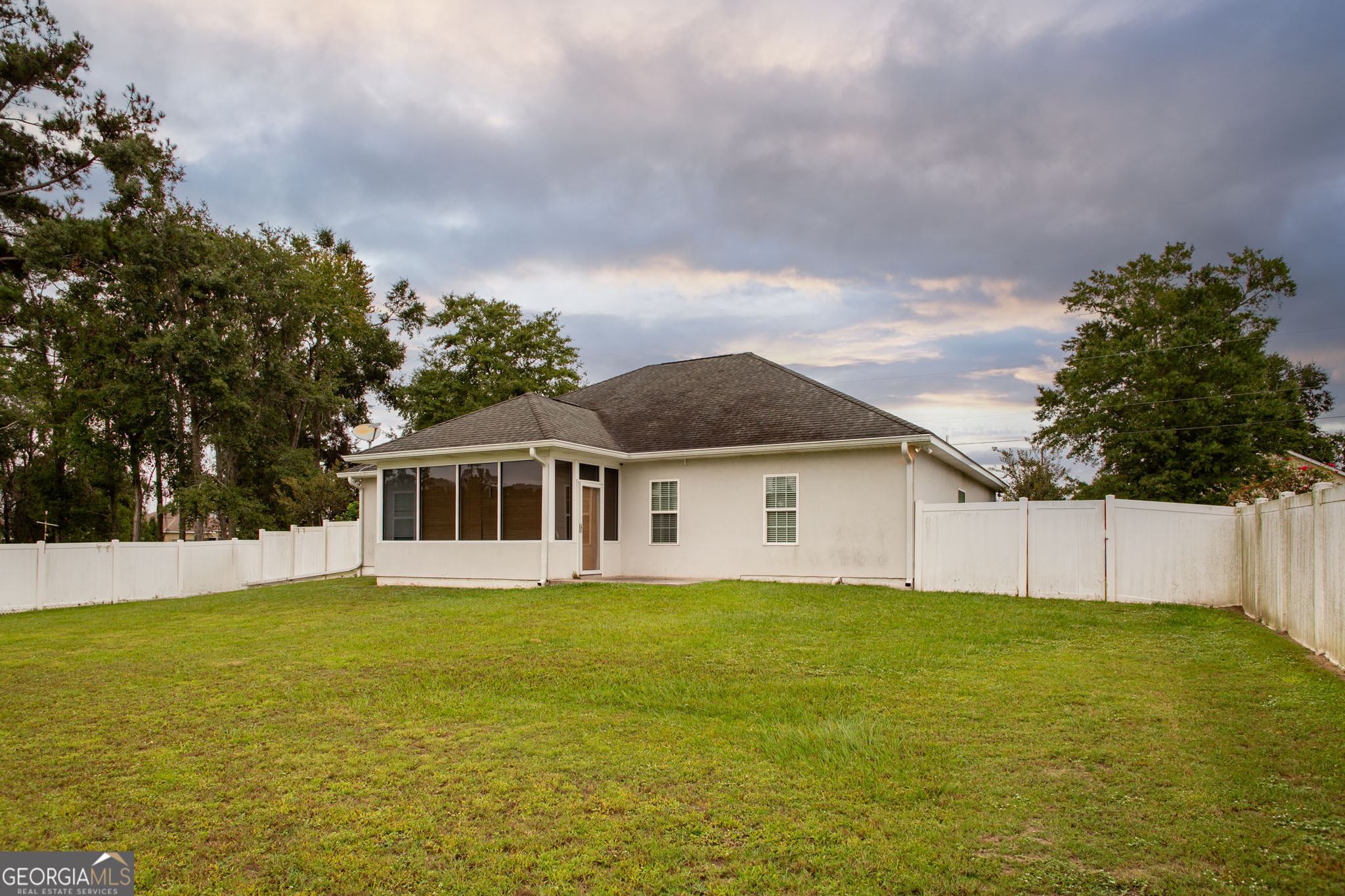 2869 Ben Street Waycross, GA 31503 - Photo 35 of 37 a view of a house with a yard and potted plants