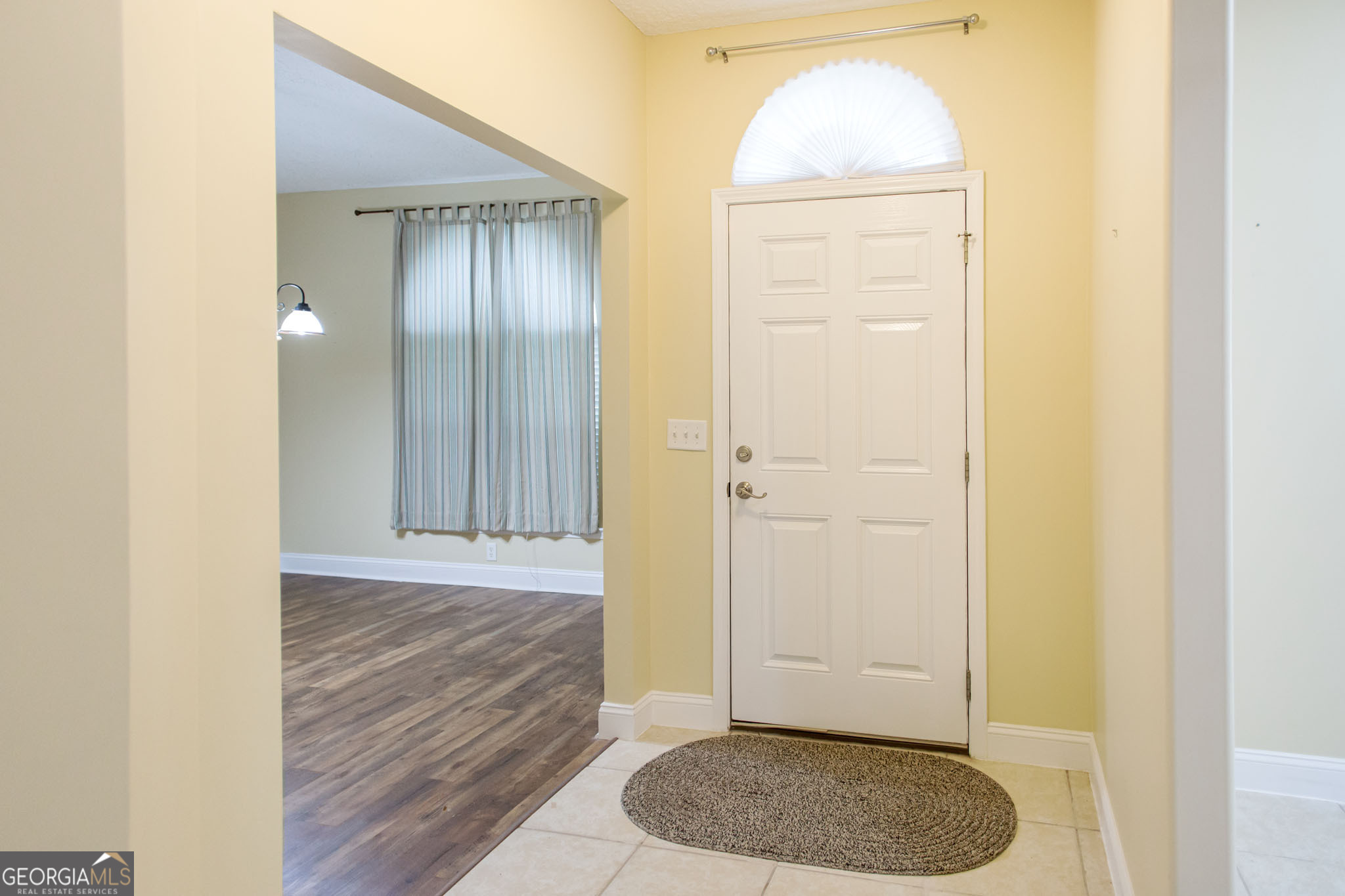 2869 Ben Street Waycross, GA 31503 - Photo 5 of 37 a view of room with wooden floor and cabinets
