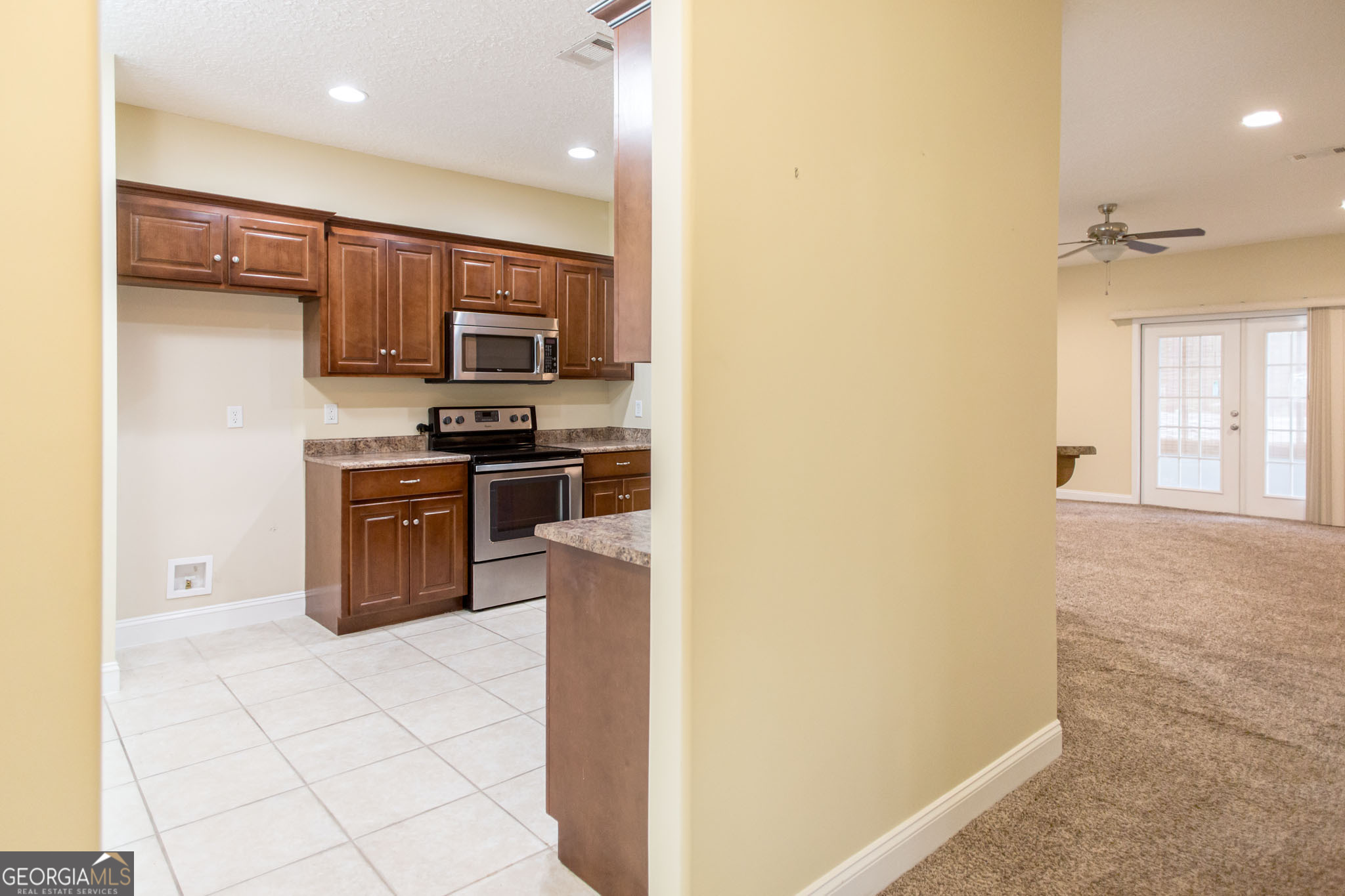 2869 Ben Street Waycross, GA 31503 - Photo 8 of 37 a kitchen with stainless steel appliances granite countertop a stove a sink and a refrigerator