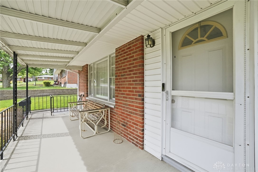 877 Woodhill Road Riverside, OH 45431 - Photo 4 of 42 This inviting porch entry offers a welcoming transition into a comfortable living space.