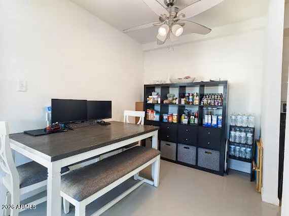 a view of workspace with a bookshelf