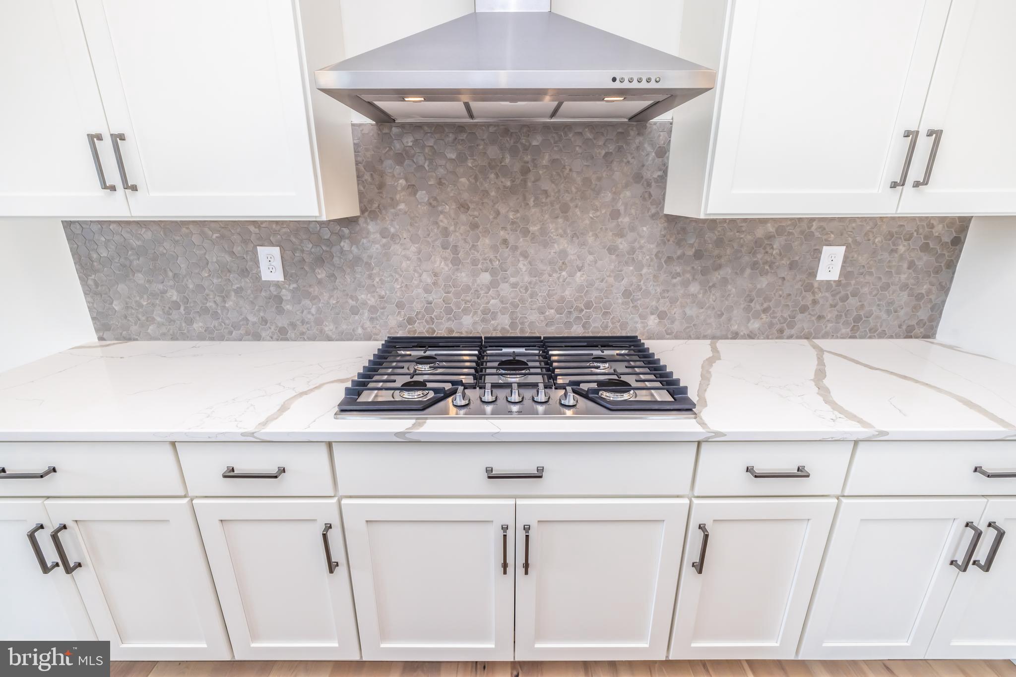 36 Midsummer Drive Newtown Square, PA 19073 - Photo 9 of 29 Five burner gas cooktop w/chimney fan.