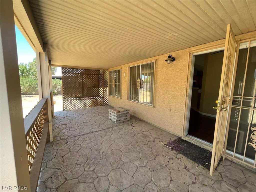3500 Redwood Ridge Way North Las Vegas, NV 89031 - Photo 12 of 13 Relax on this covered patio, offering a private outdoor retreat.