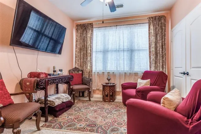 a living room with furniture a couch and a chandelier