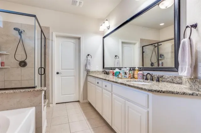 a bathroom with a double vanity sink mirror and double