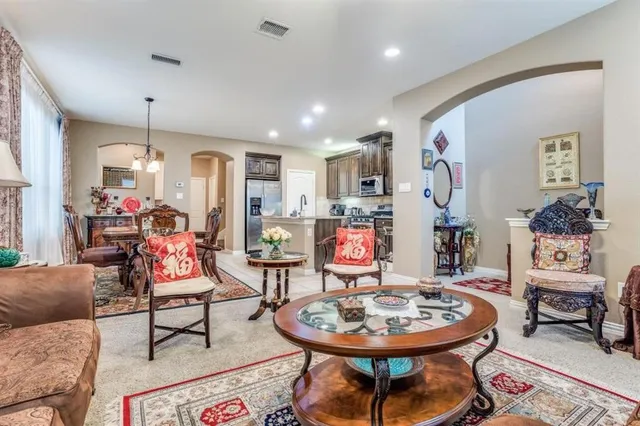 a living room with furniture and a table