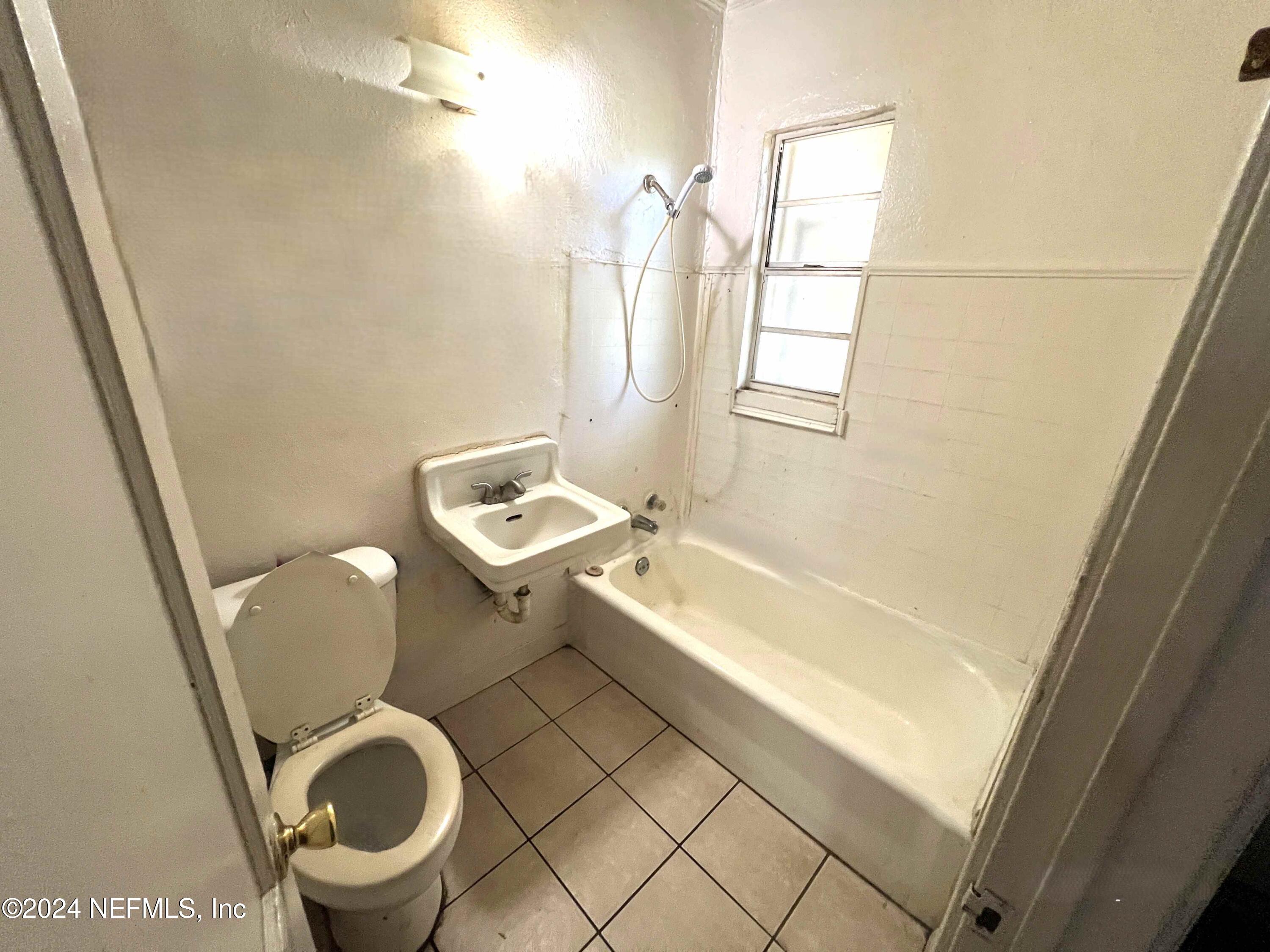 1857 Brookview Drive South Jacksonville, FL 32246 - Photo 12 of 12 a bathroom with a sink and a mirror
