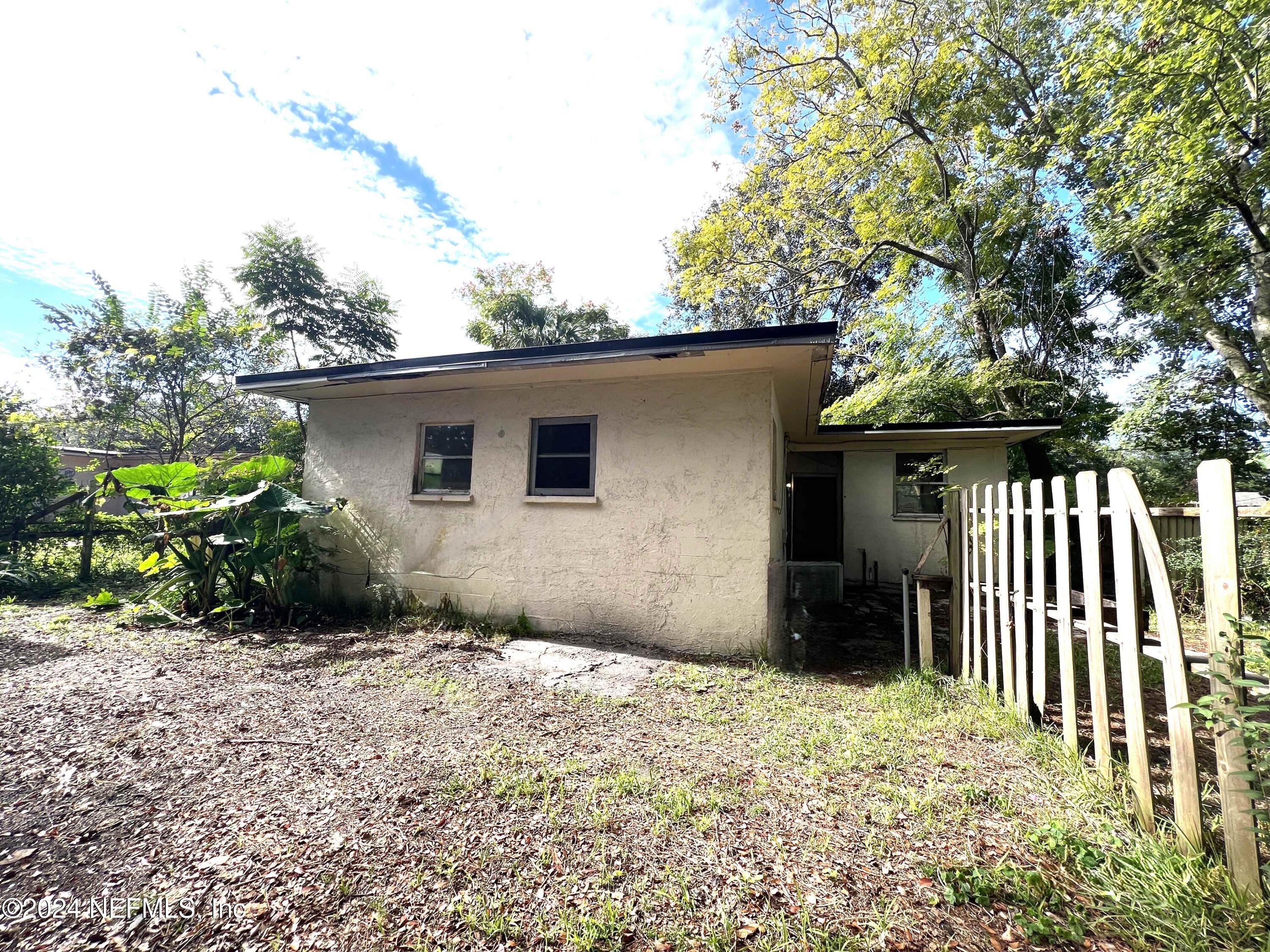1857 Brookview Drive South Jacksonville, FL 32246 - Photo 2 of 12 a backyard of a house with lots of green space