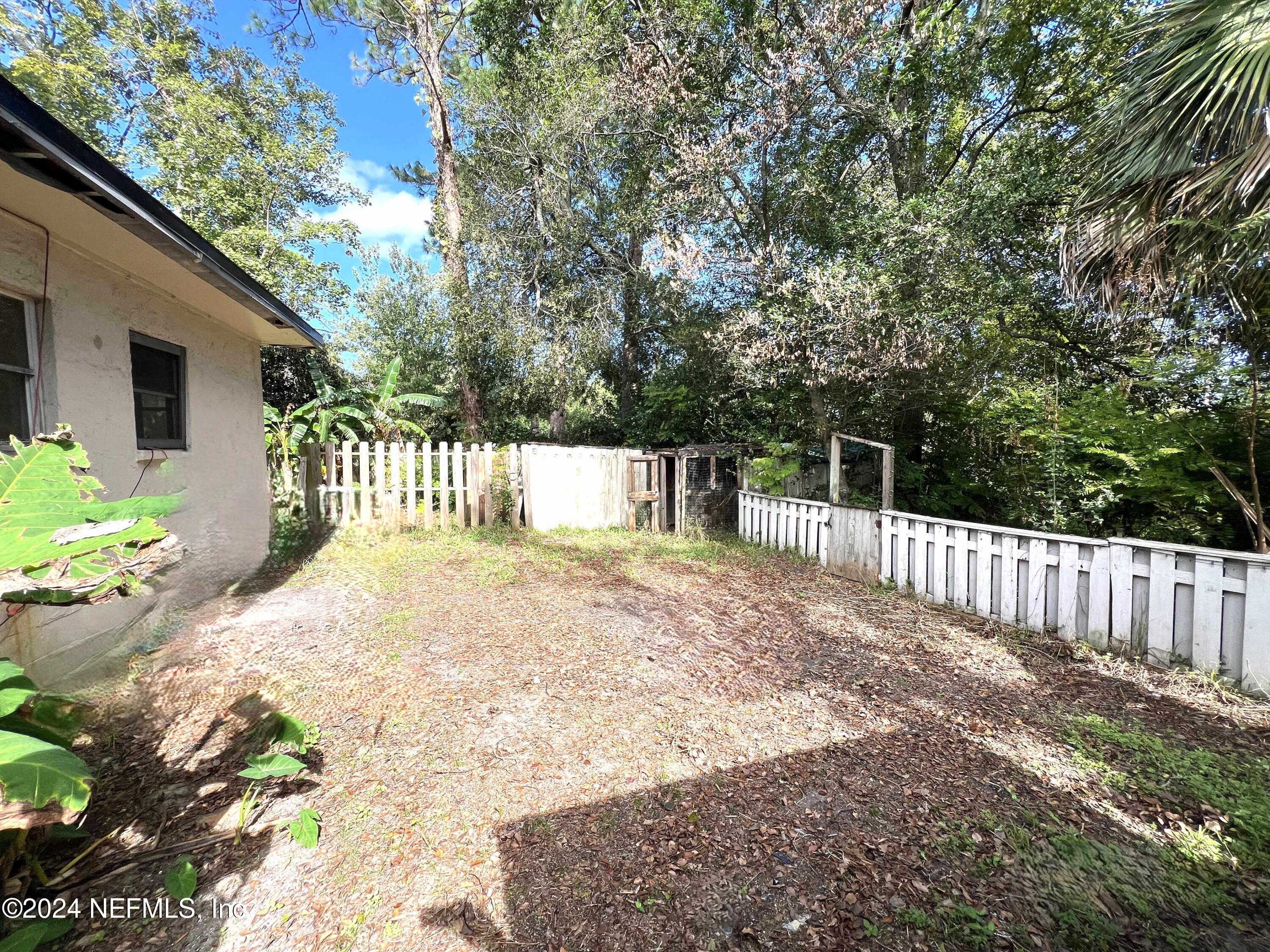 1857 Brookview Drive South Jacksonville, FL 32246 - Photo 3 of 12 a front view of a house with a yard
