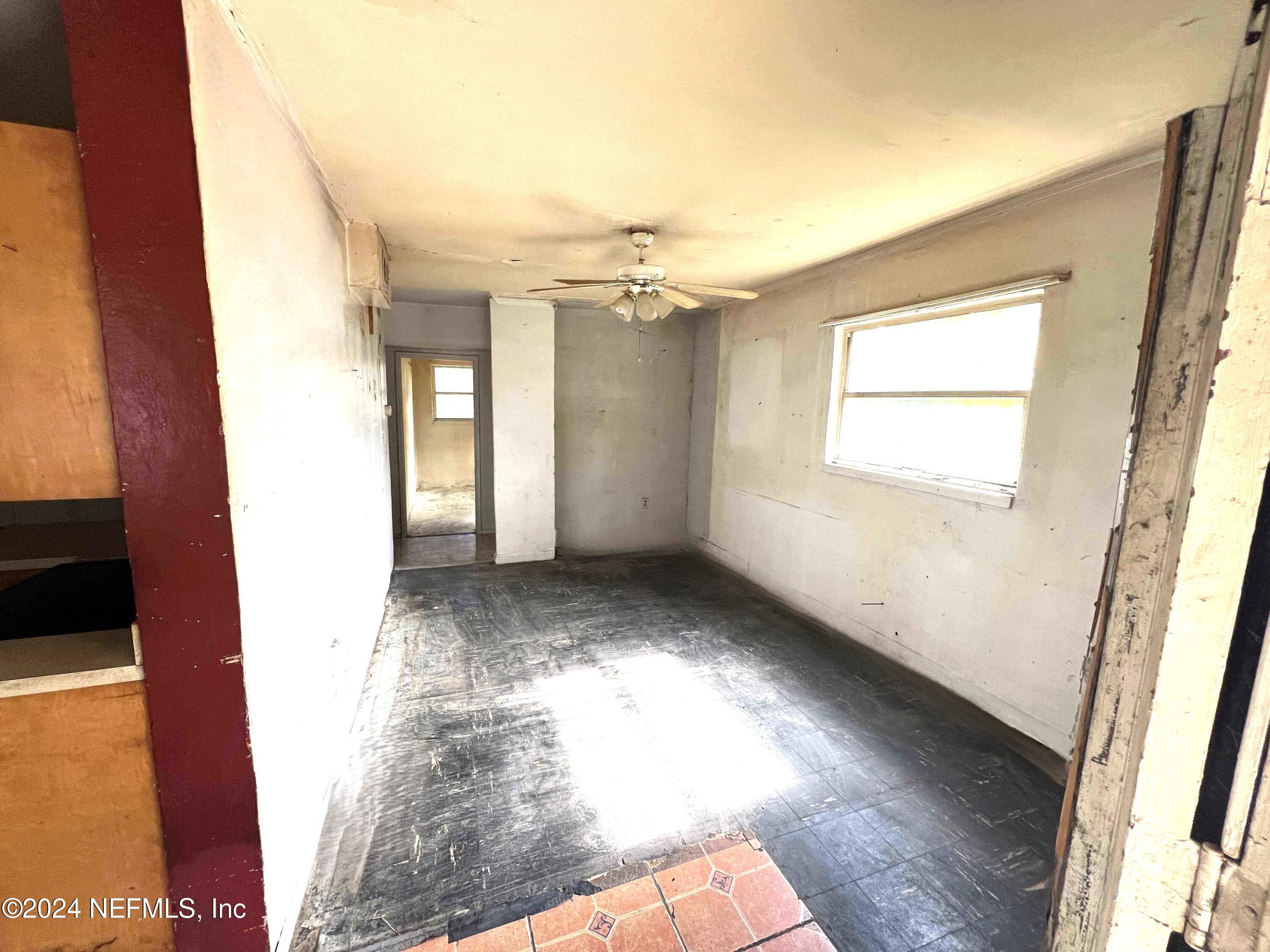1857 Brookview Drive South Jacksonville, FL 32246 - Photo 5 of 12 a view of a hallway with a window